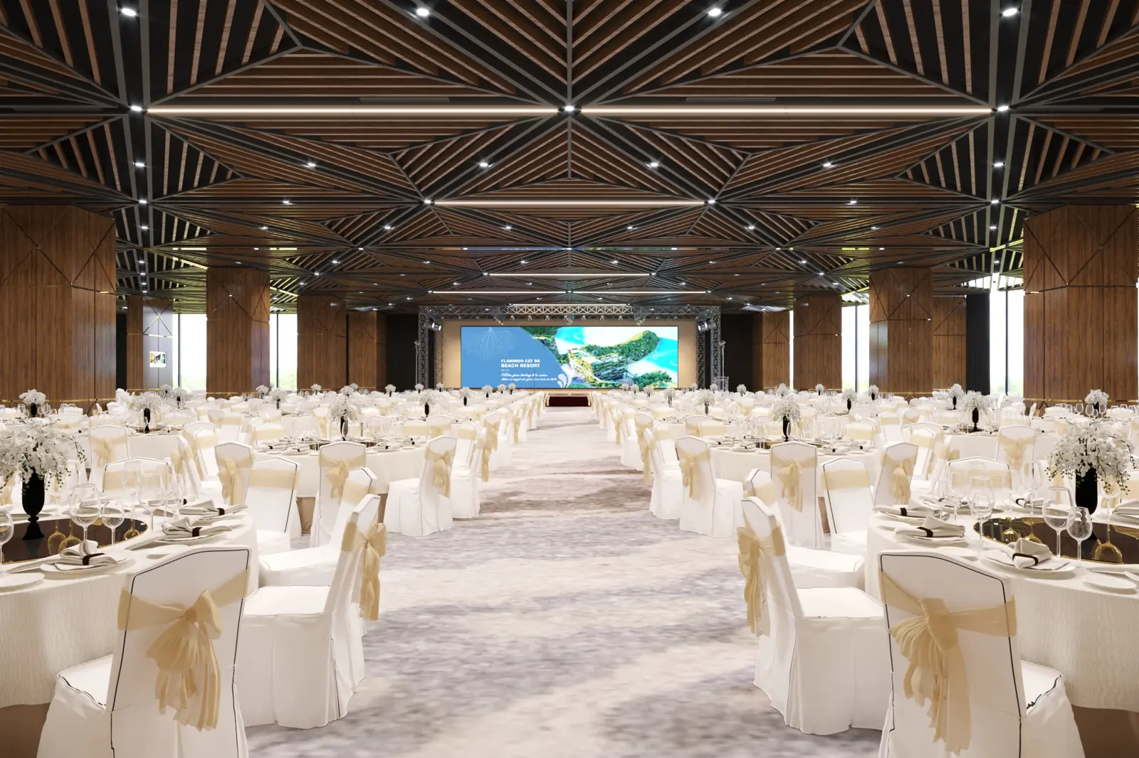 Hội trường Grand Opera ở Flamingo Cát Bà bày bàn tròn phủ khăn trắng, màn LED lớn phía sân khấu