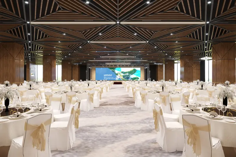 Hội trường Grand Opera ở Flamingo Cát Bà xếp bàn tiệc tròn phủ khăn trắng, sân khấu màn LED